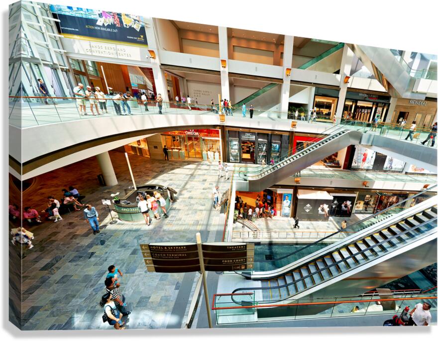 Shoppers browse stores at Marina Bay Sands Mall in Singapore