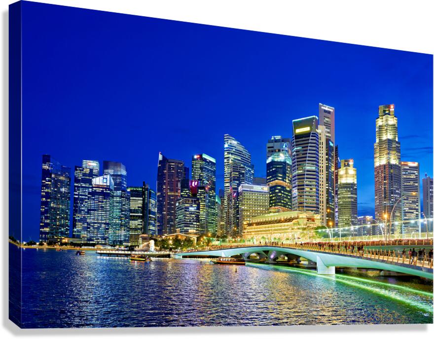 City skyline reflected on water at sunset in Marina Bay