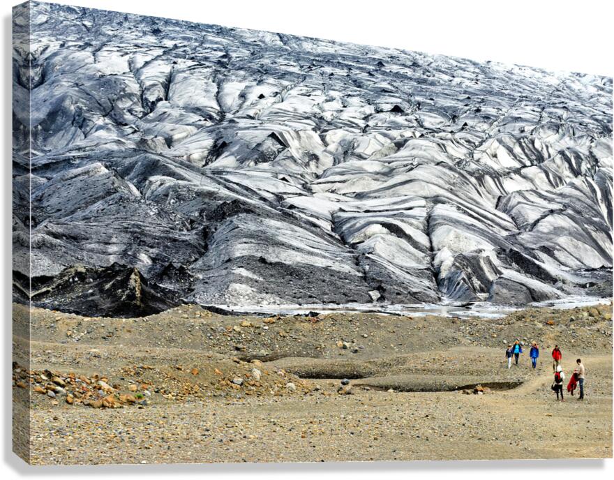 Visitors walk on Skaftafell Glacier in Iceland