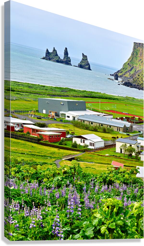 Coastline view of Reynisfjall and Vik town in Iceland