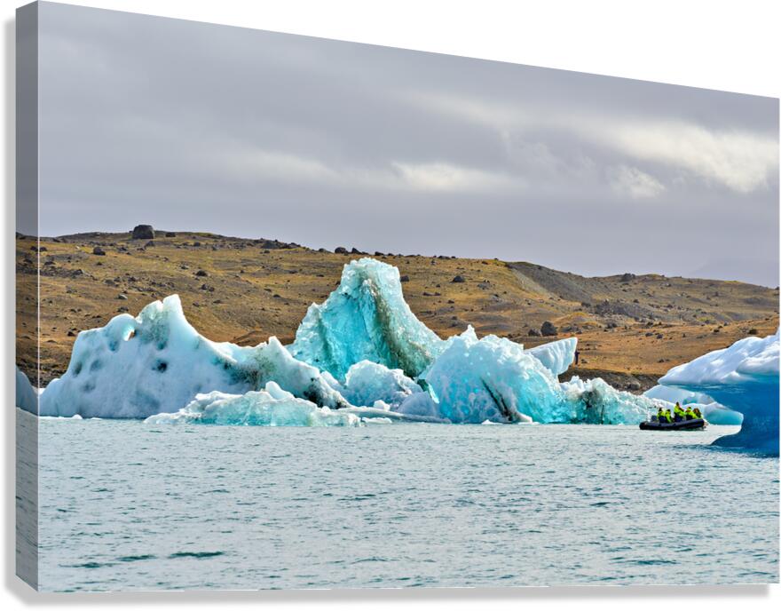 Tourists explore Jokulsarlon glacier lagoon in Iceland