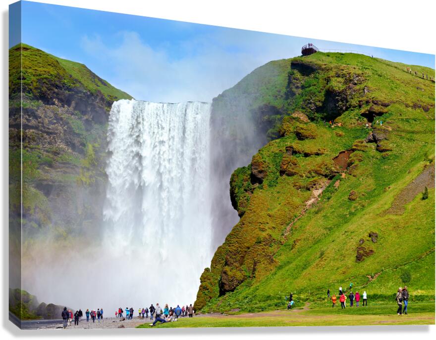People visiting Skogafoss waterfall during daylight in Iceland