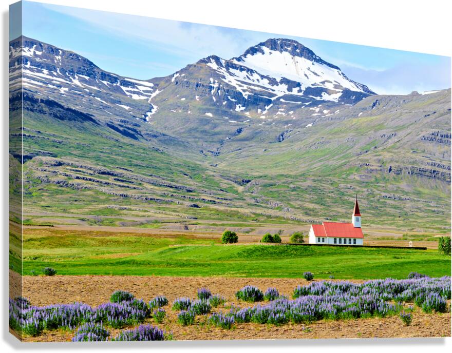 Heydalir Church in Iceland with mountains in the background