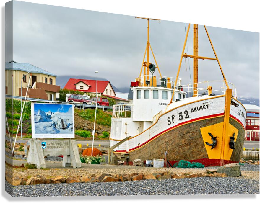 Visit to Hofn harbor in Iceland with fishing boat and sign