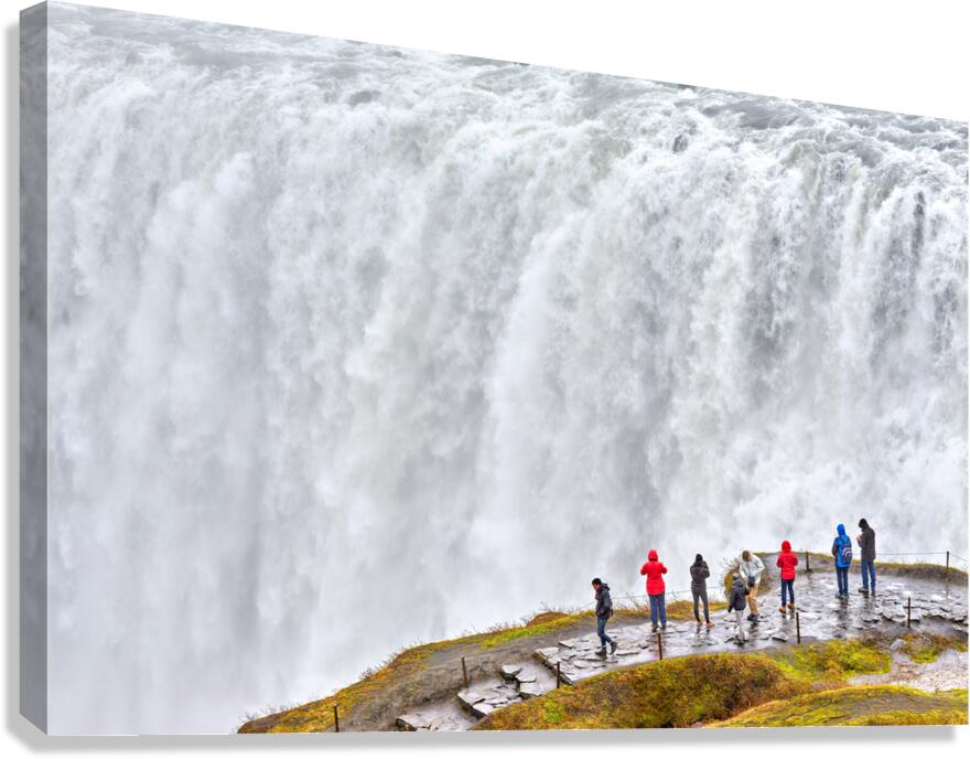 Waterfall view at Dettifoss in Iceland with visitors nearby