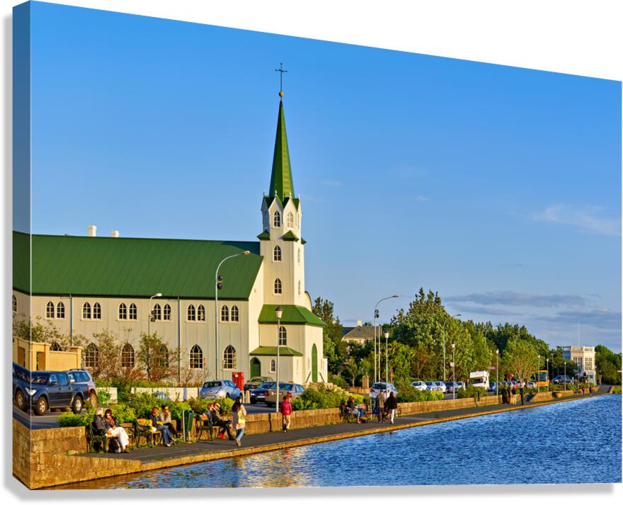 Lutheran free church by lake tjornin in reykjavik iceland