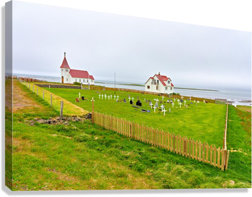 Prestbakkakirkja church and graveyard in Iceland by the sea