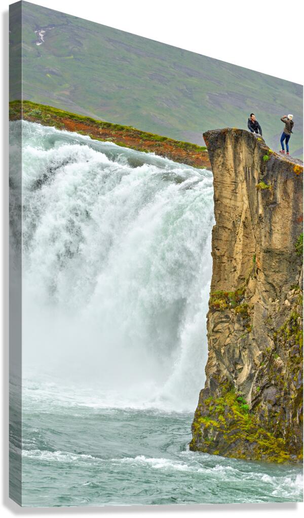 People standing near Godafoss waterfall in Iceland