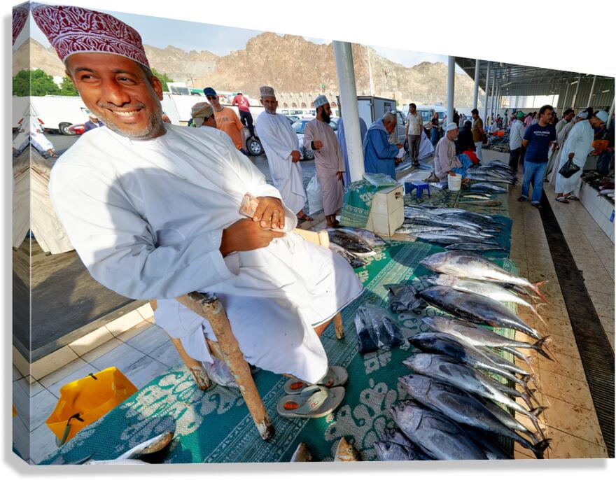 Fish market in Muscat Oman with vendor selling fish