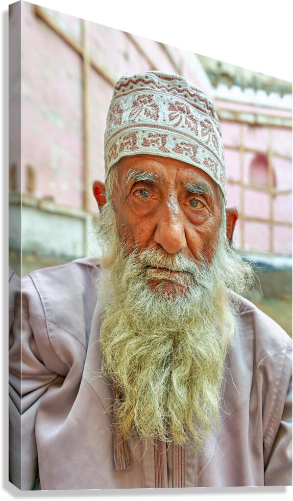 Senior man with white beard in Muscat Oman courtyard