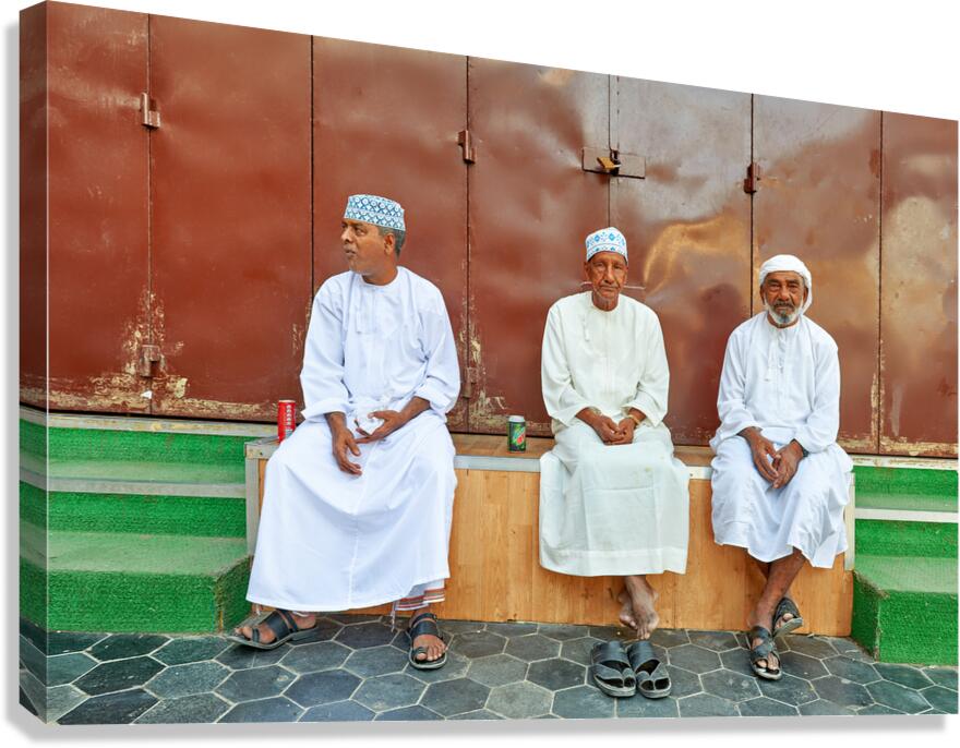 Local men relax on a bench in Muscat Oman during the afternoon