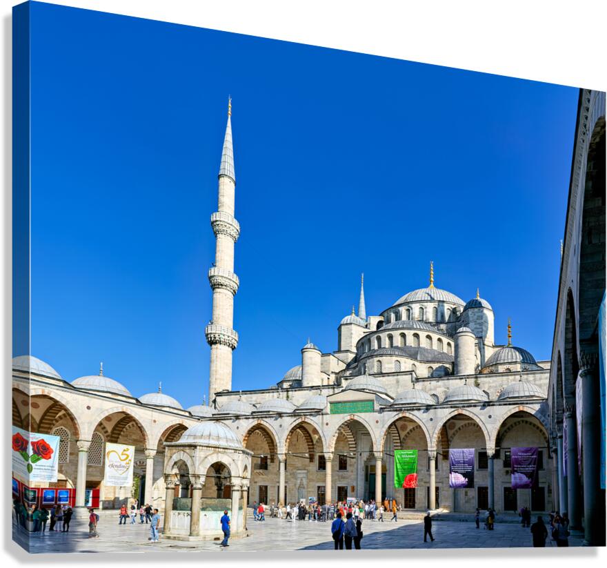 People walk around the Blue Mosque in Istanbul Turkey