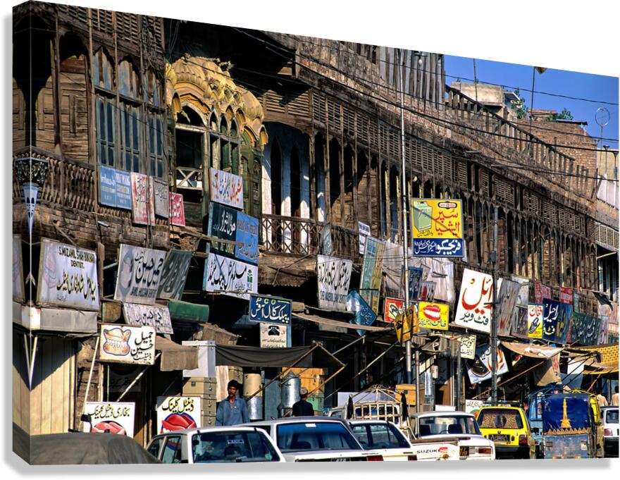 Streets in Peshawar with shops and vehicles