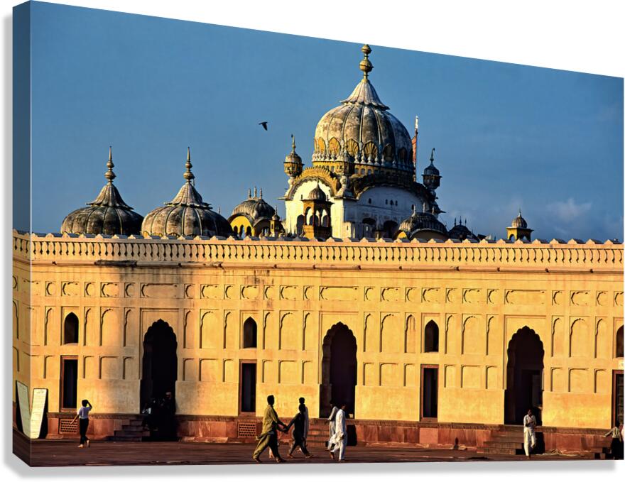 Visitors explore Badshahi Mosque in Lahore at sunset