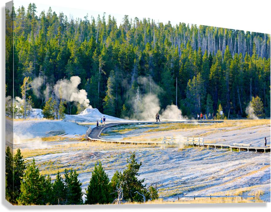 People explore the boardwalks in Upper Geyser Basin