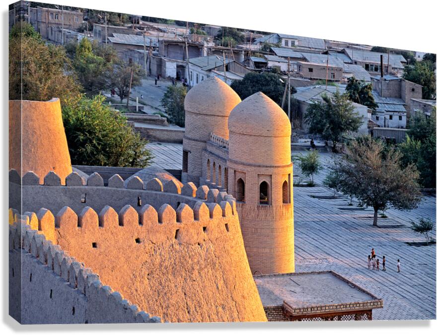 View of Khiva in Uzbekistan with historic buildings and people