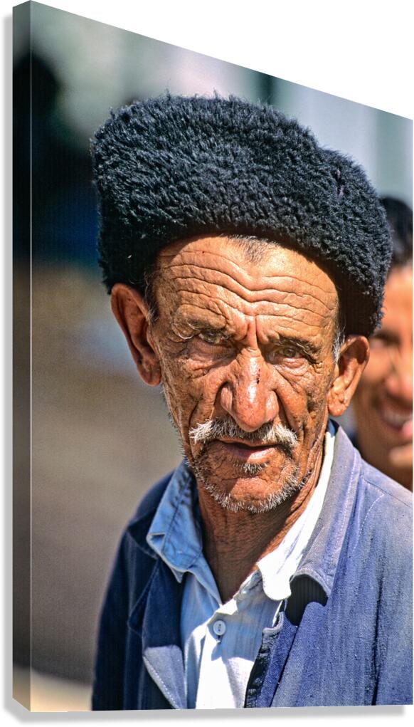 Old man wearing traditional hat in Khiva Uzbekistan