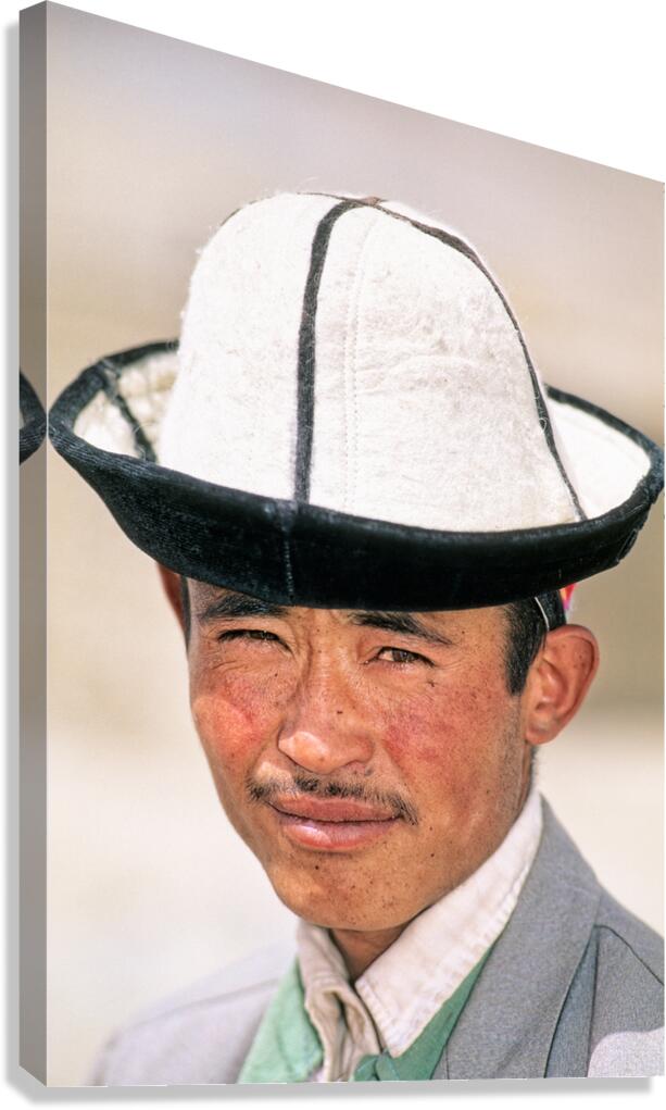 Young man in traditional hat from Uzbekistan