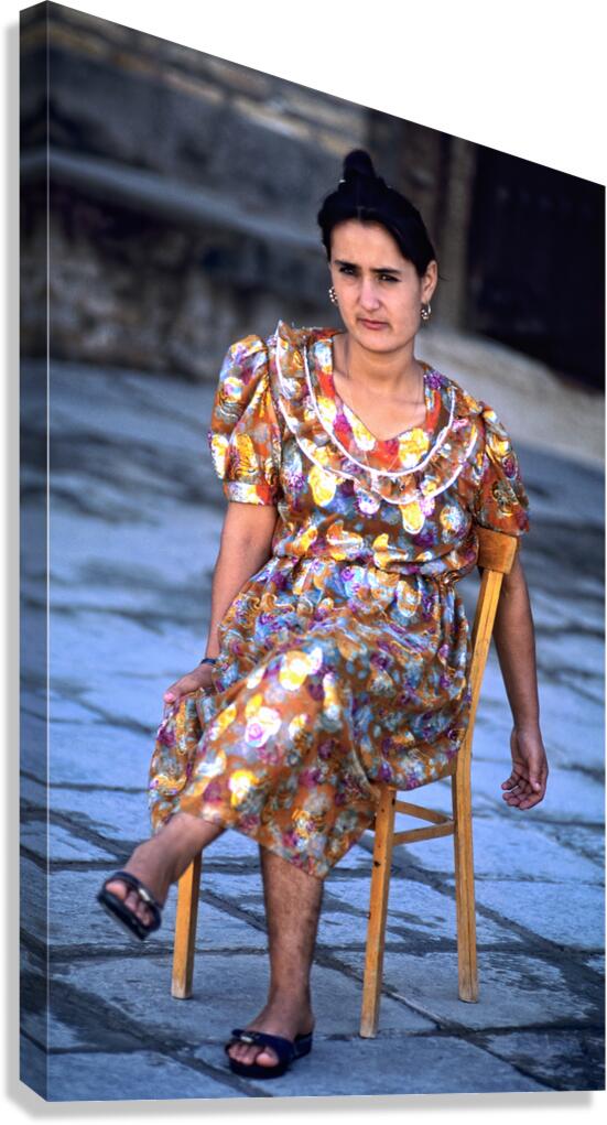 Woman sitting on a chair in Khiva Uzbekistan