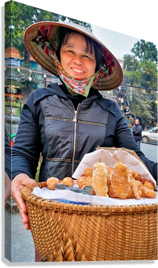 Street vendor sells snacks in Hanoi with a big smile