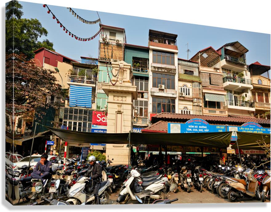Market scene with motorcycles in Hanoi Vietnam during the day
