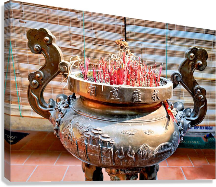 Hanoi incense burner with red sticks in a local setting
