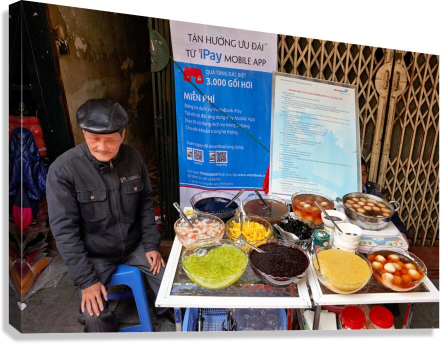 Street vendor selling desserts in Hanoi Vietnam at market