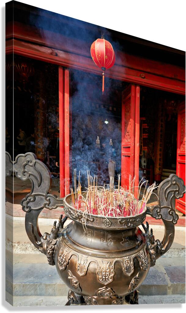 Hanoi temple features incense burner and lanterns in Vietnam
