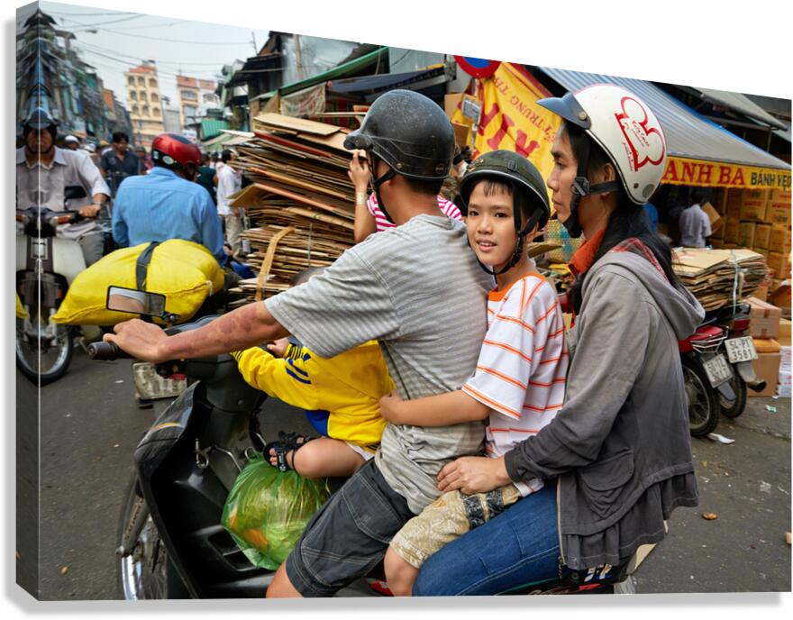 Traffic in Ho Chi Minh City with a family on a motorbike