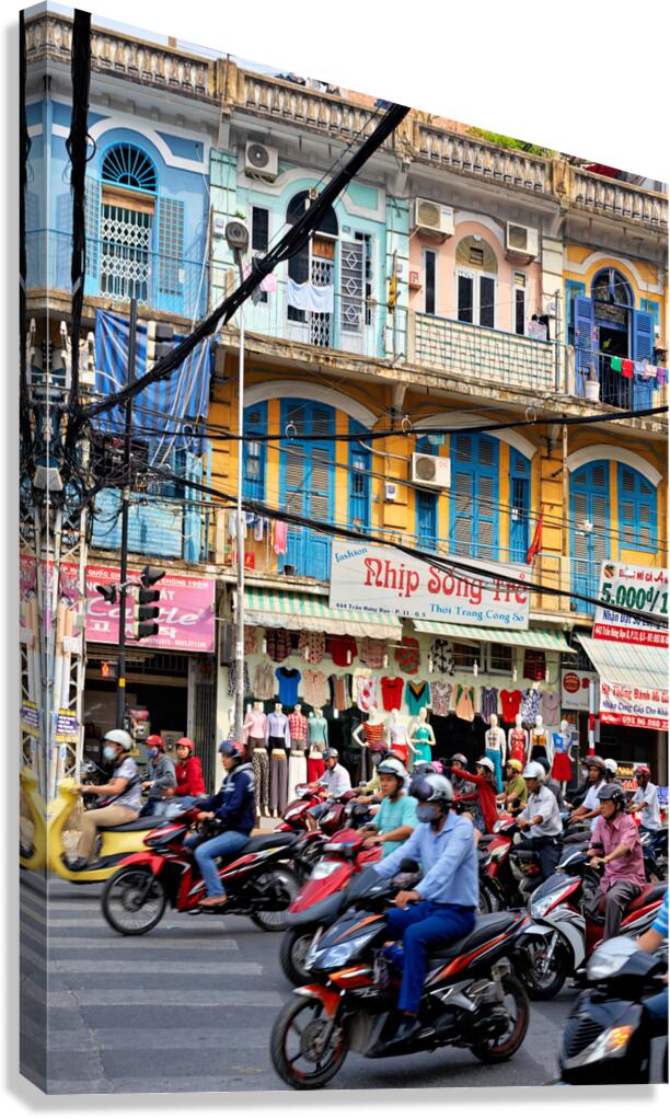 Traffic in Ho Chi Minh City with shops in the background