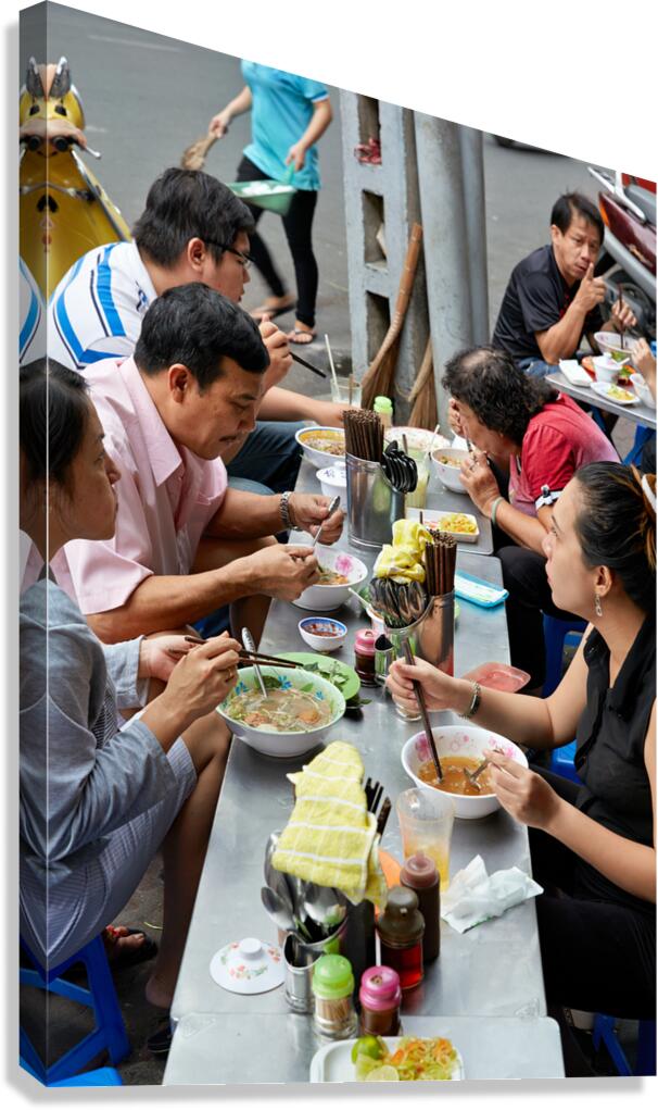 People eating at street food stalls in Ho Chi Minh City