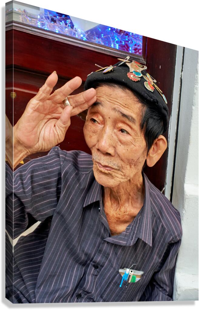 Old man salutes in Ho Chi Minh City streets
