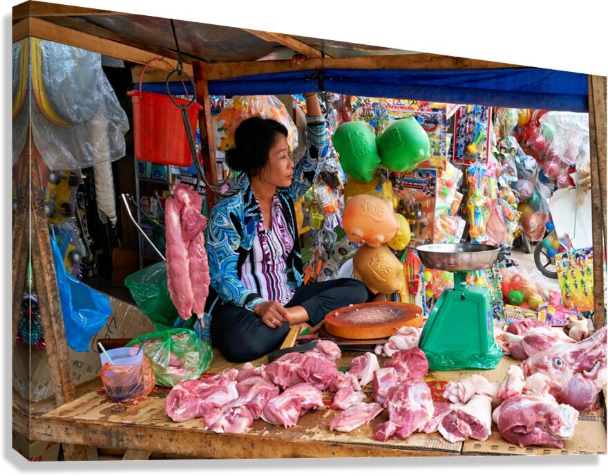 Market scene in Phu Quoc with seller and meat display