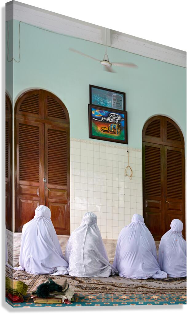 Muslim women pray in a room in Ho Chi Minh City