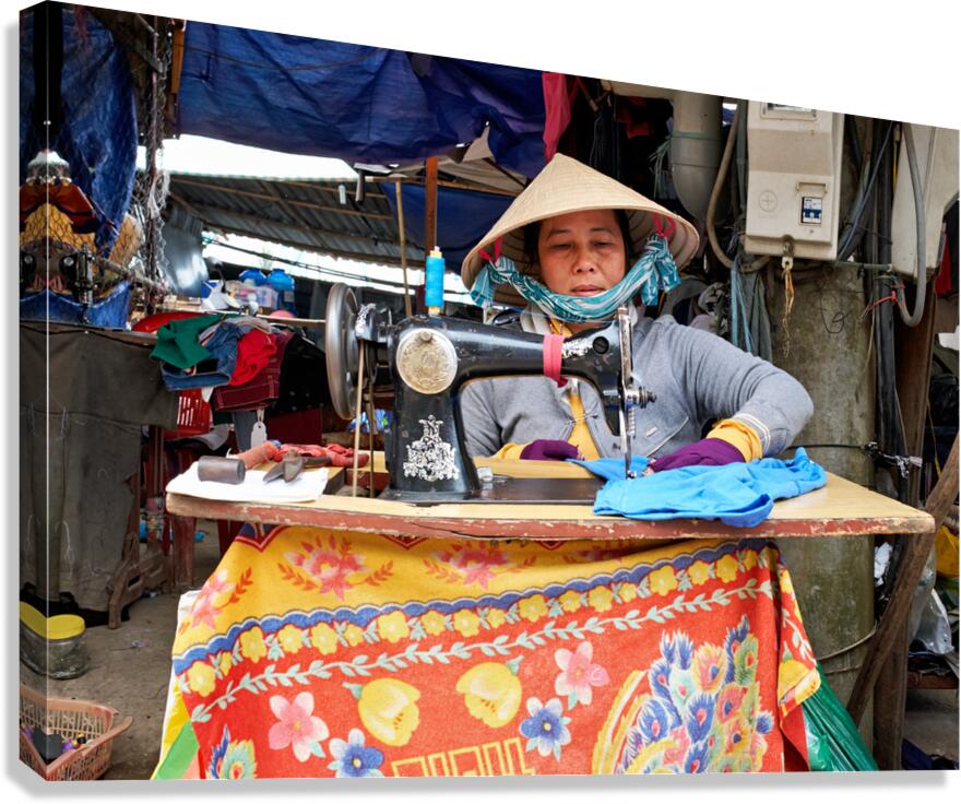 Woman sewing at a market in Phu Quoc Vietnam during the day