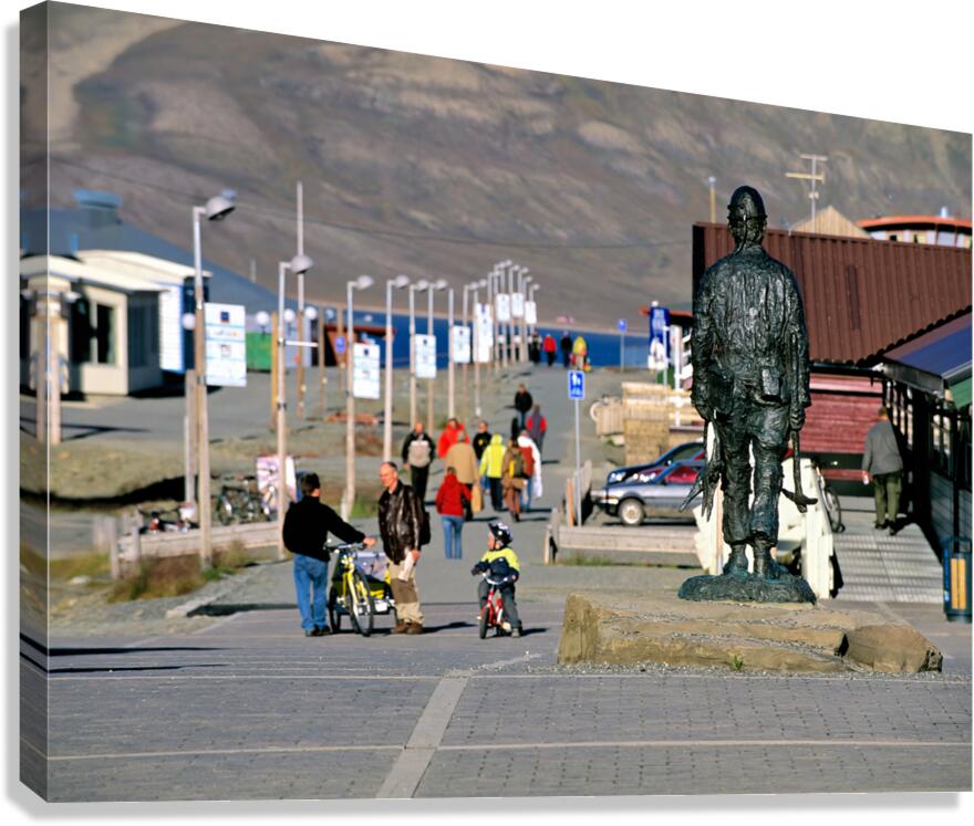 Streets of Longyearbyen with people and a statue