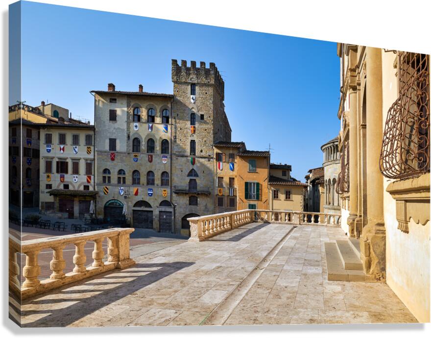 People walk through Piazza Grande in Arezzo Italy