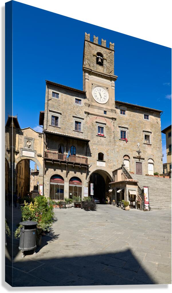 People visit Piazza della Repubblica in Cortona during sunny day