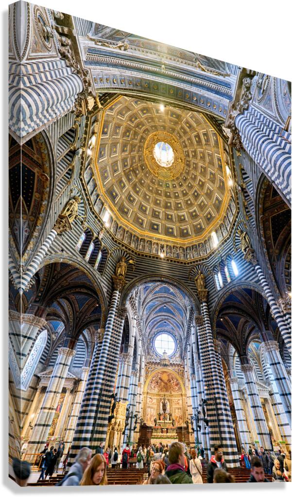 Siena cathedral in Tuscany with visitors exploring inside
