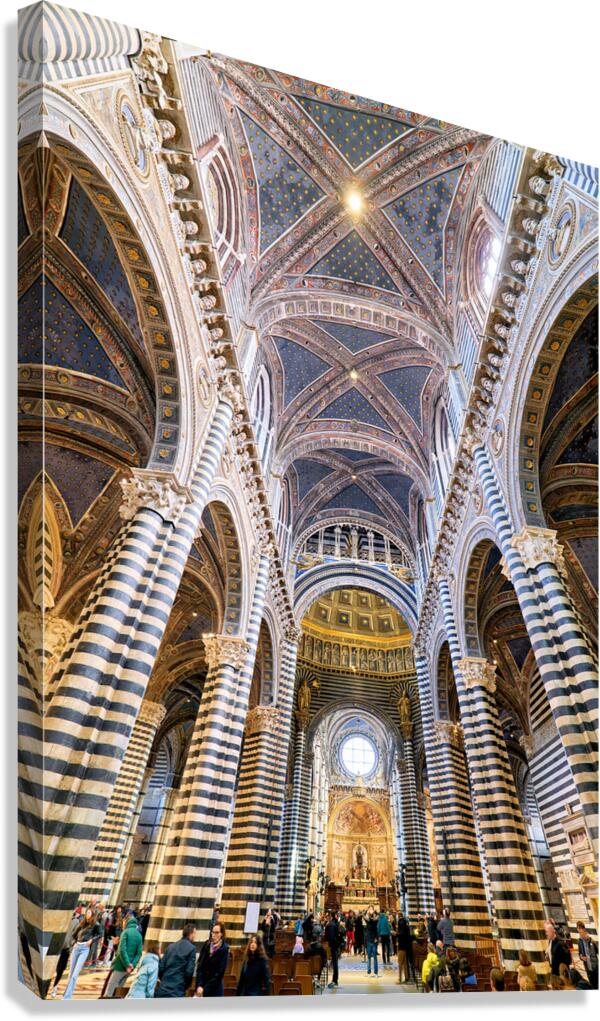 Siena Cathedral interior shows arches and visitors in Tuscany