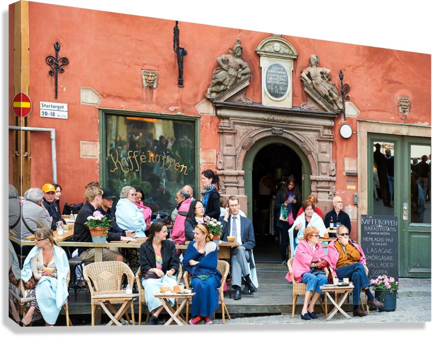 People resting in a cafe at Stortorget square in Gamla Stan