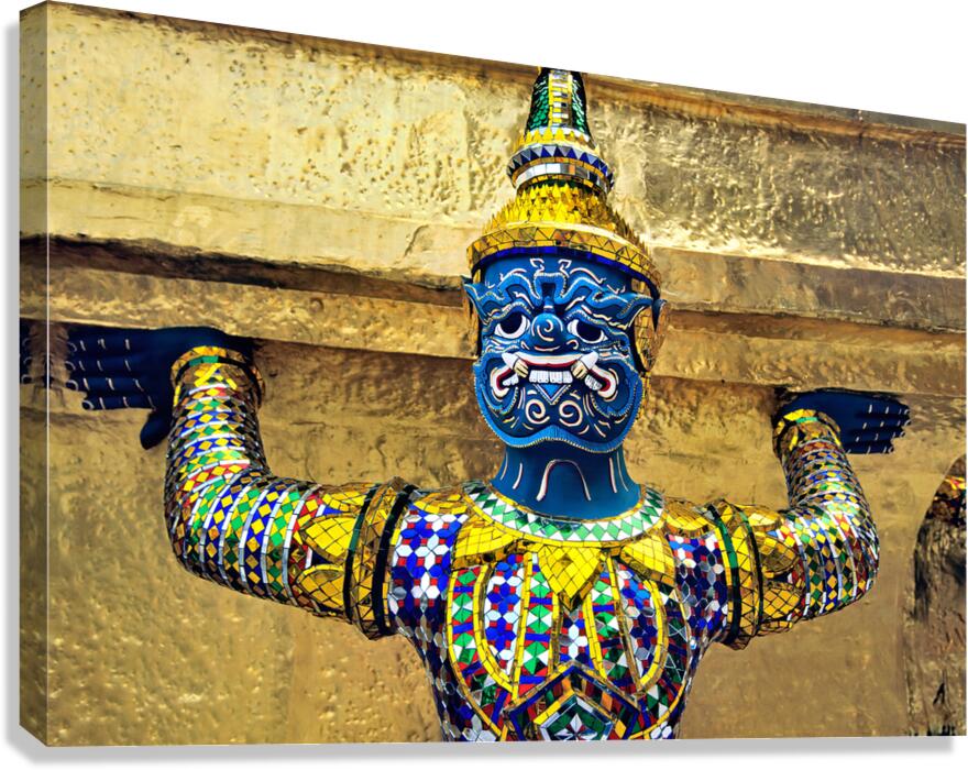 Statue at Wat Phra Kaew in Bangkok holds up structure