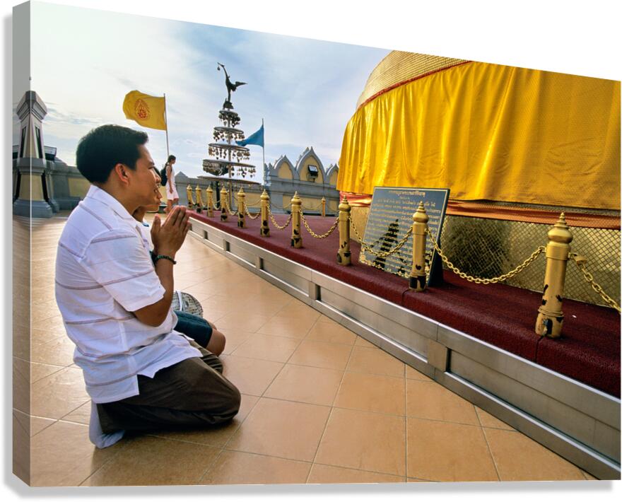 Visitor prays at Wat Saket Golden Mount in Bangkok Thailand