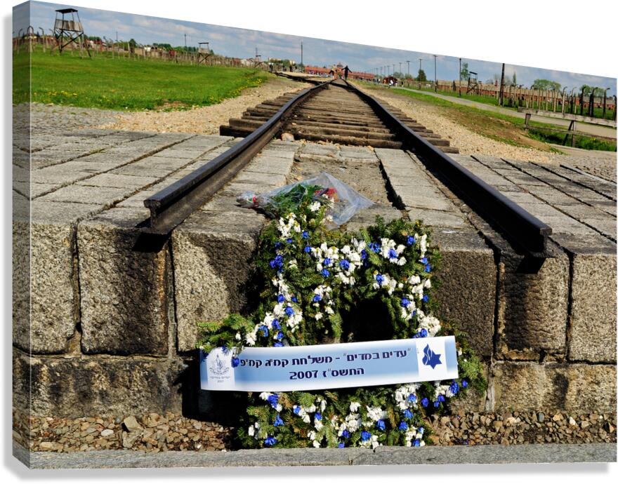 Wreath placed at railroad tracks in Auschwitz concentration camp