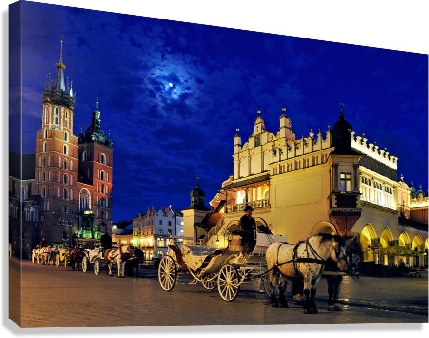 Krakow evening scene with horse drawn carriage near town square