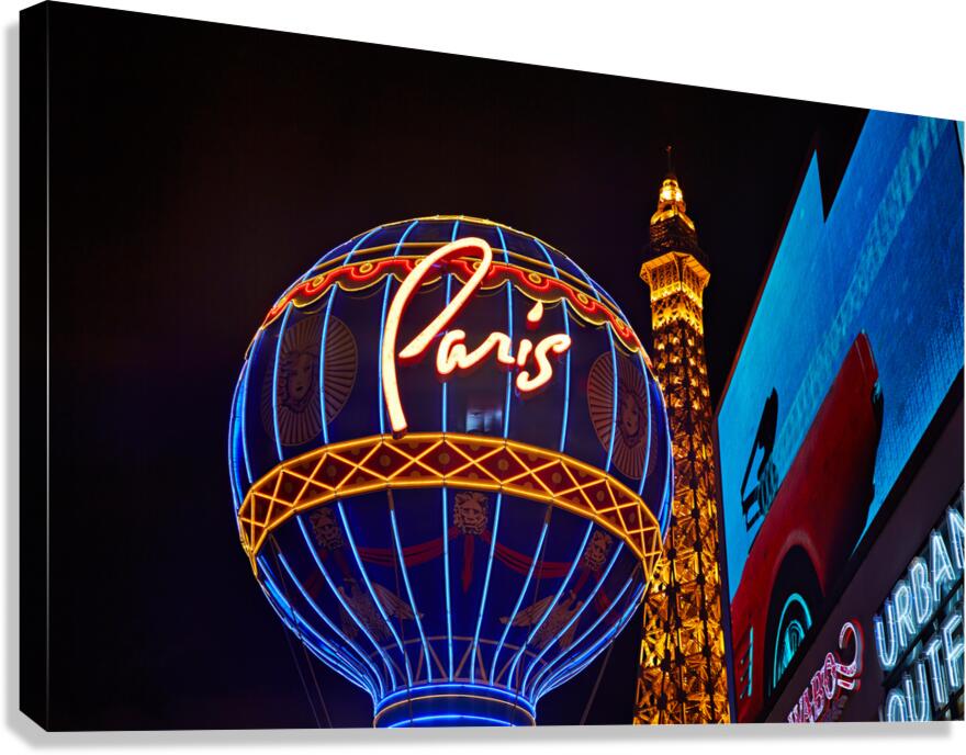Las Vegas Strip at night with Paris balloon and Eiffel Tower