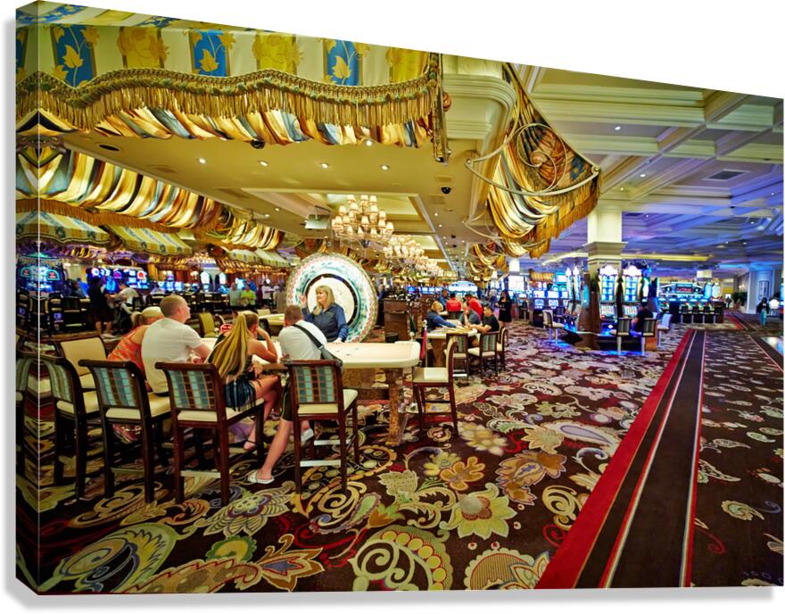 Visitors play slot machines at Bellagio Casino in Las Vegas