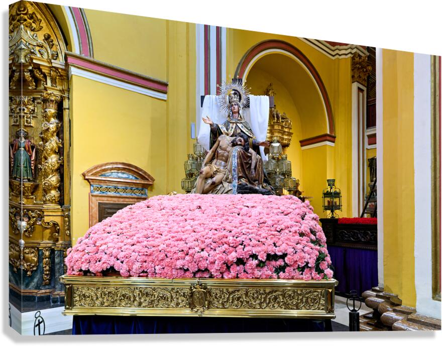 Visitors admire the statue in Iglesia de Santa Isabel