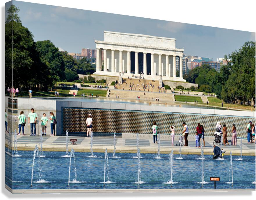 Visitors walk around the National World War II Memorial