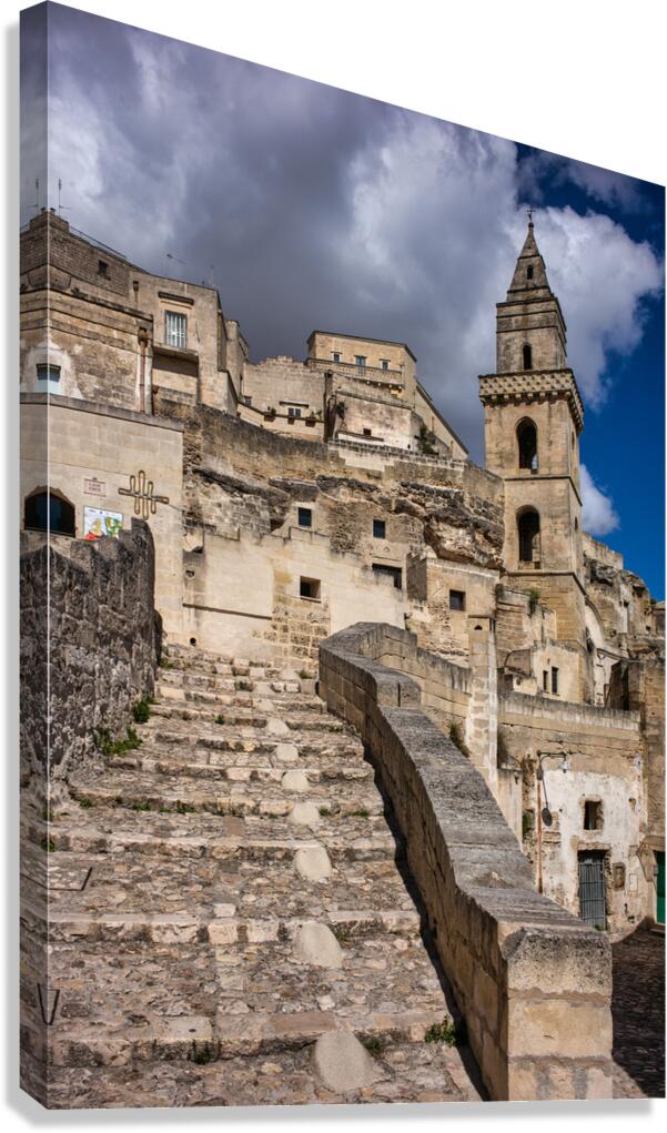 Visitors walk up the stone steps in Matera Italy
